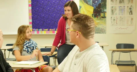Teacher having a discussion with students and teaching class. Ultra HD 4K Stock Footage 45573869