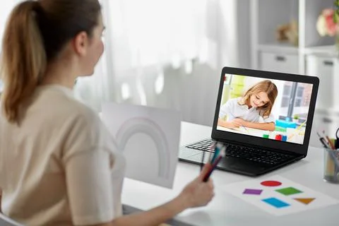 Teacher having online class at home Stock Photos