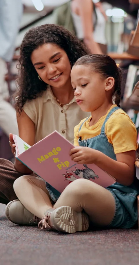 Teacher, help and child with book in library for knowledge, fantasy story and Stock Footage 335782772