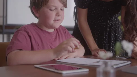 Teacher Helping Her Student Solve A Math Problem Stock Footage 208803891