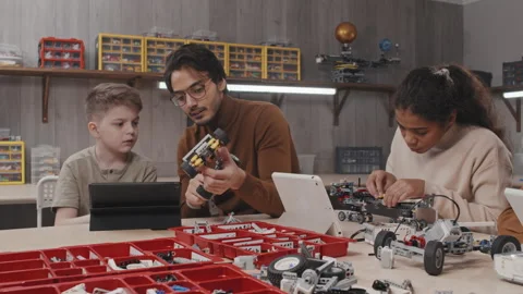 Teacher Helping Student To Build Construction Stock Footage 203818376