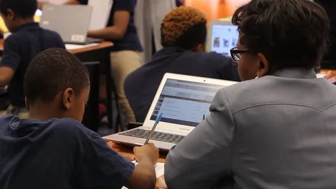 Teacher helping student Stock Footage 92495806