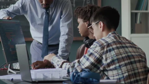 Teacher Helping Students at Programming and Engineering Class Stock Footage 284431902