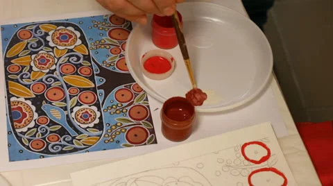 Teacher helps child to paint watercolor picture Stock Footage 59582585