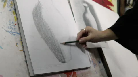 Teacher helps student draw in class Video stock 152722580