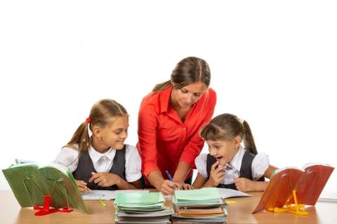 Teacher Helps Students Solve an Example Foto stock