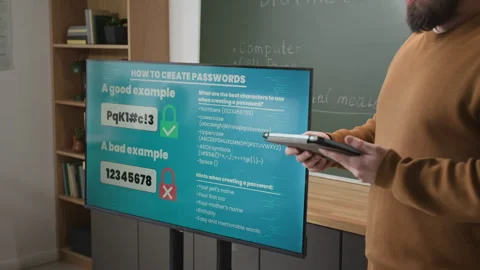 Teacher Holding Tablet by Board in Computer Literacy Class Stock Footage 333756885