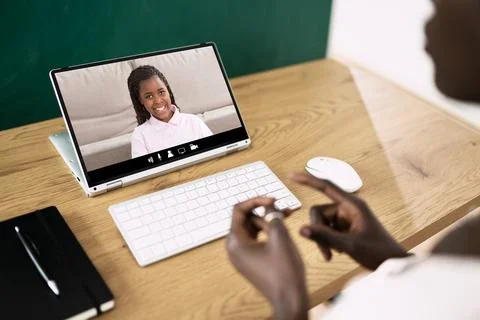 Teacher Hosting Online Class Using Video Conference Stock Photos