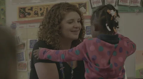 Teacher hugging student Stock Footage 62828377