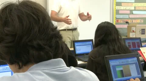 Teacher instructing computer class (1 of 2) Video stock 8979036