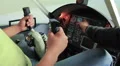 Teacher instructing student to navigate flight simulator, man learning to fly HD Footage