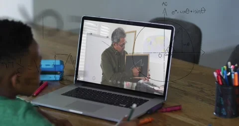 Teacher on laptop pointing triangle, causing child writing math while equations Video stock 330717802