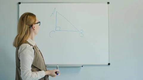 The teacher leads a geometry lesson for younger children. Stock Footage 129398182