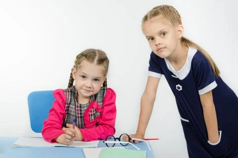 The teacher leaned on table student Stock Photos