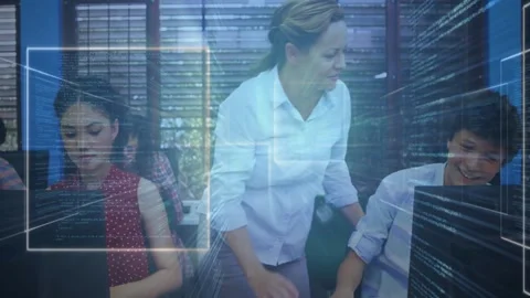 Teacher leaning, pointing at screen, teaching code to student high-fiving, Stock Footage 331197607