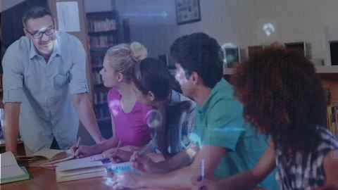 Teacher leaning at school table, pointing at book, urging writing while circles Vídeos de archivo 331713132