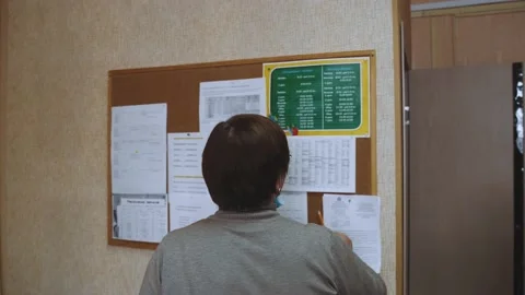The teacher looks at the schedule Stock Footage 150508696