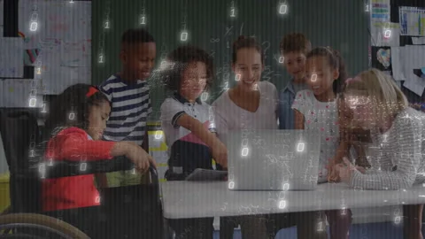 Teacher opening laptop for coding, students watching, boy tapping keyboard Stock Footage 311506135