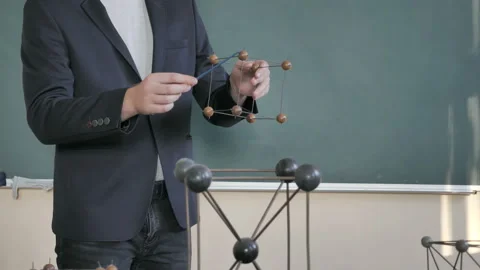 Teacher Or Student With Molecular Model In Classroom. Chemistry Lesson Stock Footage 138047762