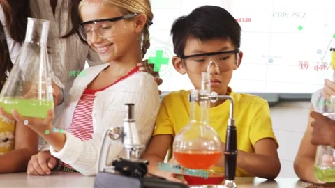 Teacher placing hand on student shoulder, guiding science class comparing Stock Footage 333911234