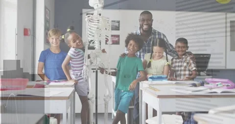 Teacher placing hands on pupils, posing around skeleton as overlays showing blue Stock Footage 332280645