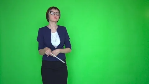 Teacher with a pointer dances on green screen background Stock Footage 83599347