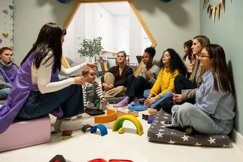 Teacher pointing during class at kindergarten Stock Photos