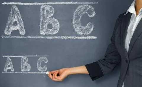 Teacher points to the ABC alphabet Stock Photos