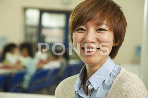 Teacher portrait at lunch in school cafeteria Stock Photos