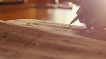 A teacher is putting a mark to the diary Stock Footage 85560660