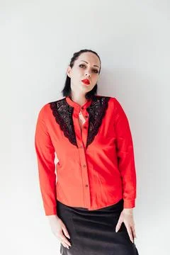 Teacher in red business suit with pointer on white background Stock Photos