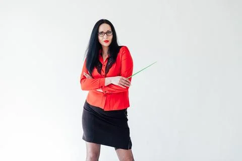 Teacher in red business suit with pointer on white background Stock Photos