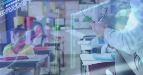Teacher rotating glasses and activating AR overlay teaching coding while Stock Footage 325706933