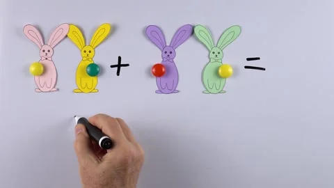 The teacher shows an example of an educational math game for children  Stock Footage 150659284