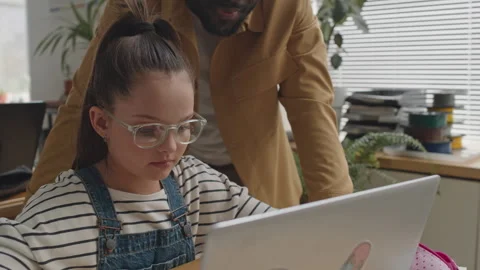Teacher Speaking with Girl during Programming Class Stock Footage 245457706