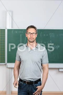 Teacher standing in classroom Stock Photos