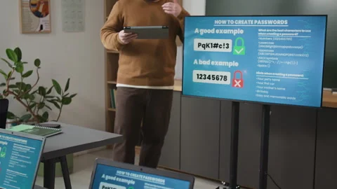 Teacher Standing by Digital Safety Board in Computer Class for Seniors Stock Footage 333755902
