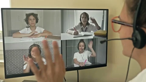 Teacher starts a video tutorial for a group of students. Features of distance Stock Footage 140009446