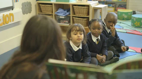 Teacher with student in classroom Stock Footage 32695951