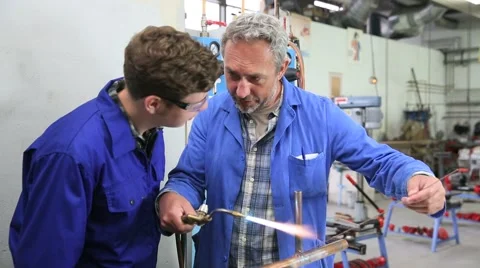 Teacher with student in metallurgy workshop Stock Footage 51568678
