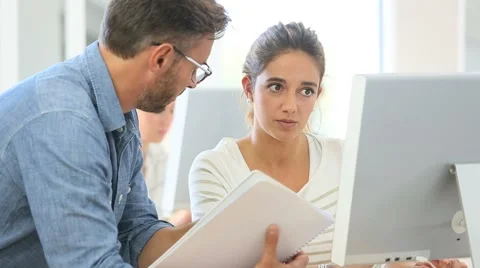Teacher with student working on computer Stock-Footage 56324203