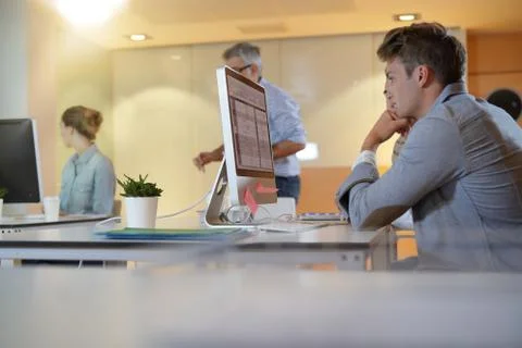 Teacher with students in apprenticeship attending computing class Stock Photos