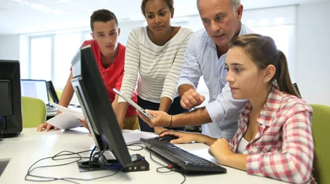 Teacher with students in computing class Video stock 37631262