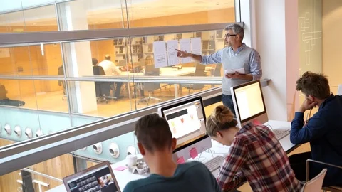 Teacher with students in computing class Stock Footage 86491312