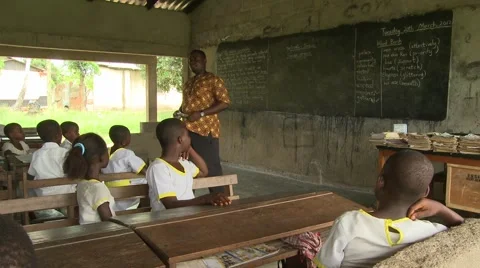 TEACHER WITH STUDENTS RAISING HANDS IN CLASSROOM Stock Footage 60116123