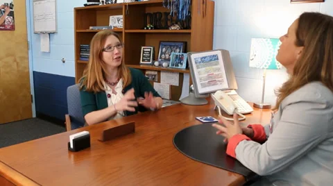 Teacher talking to principal Video stock 37211687