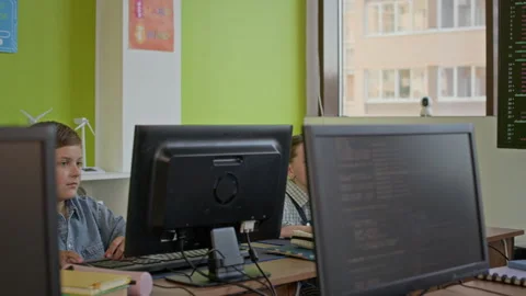 Teacher Talking to Schoolboy during Explanation of Subject Points at Lesson Stock Footage 316479964