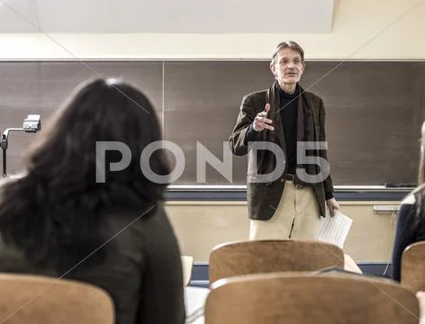 Teacher Talking To Students In Classroom