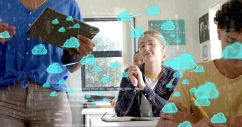 Teacher tapping tablet and illustrating cloud computing with code icons drifting Stock Footage 317592154