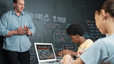 Teacher teach about coding system while student fixing main board. Edification 動画素材 263504862